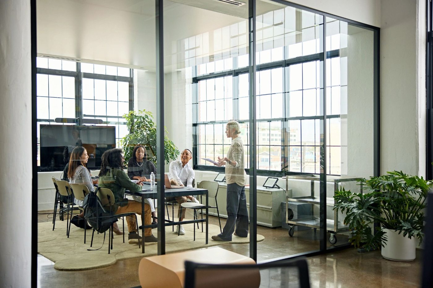 Real estate professionals meeting in a modern conference room