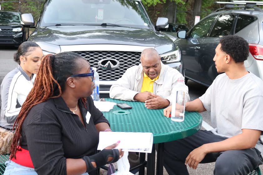 KAIZEN agents talking business at a networking event